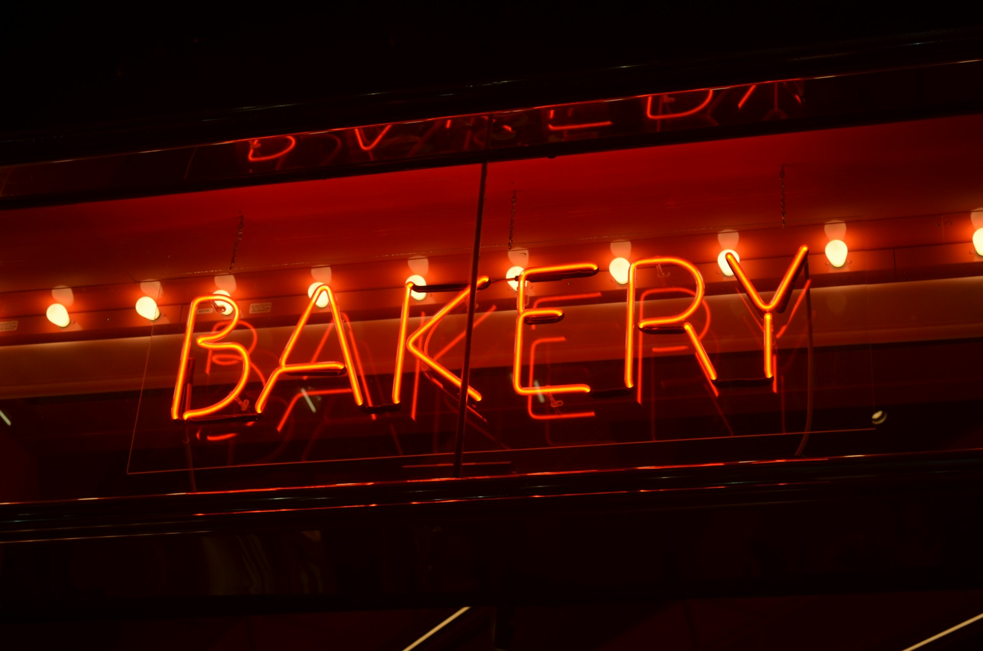 a neon sign that says bakery on it